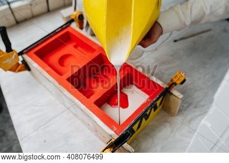Hands Pouring Gypsum Plaster In Open Form For Mold Casting For Making Tableware.