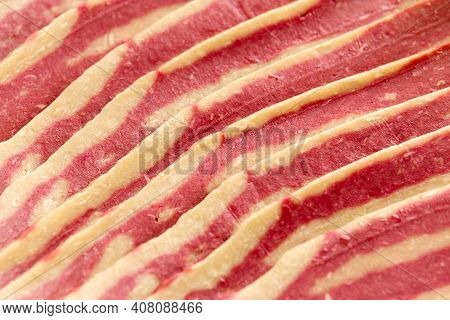 Raw Plant Based Vegan Bacon Pieces On Crumpled Paper
