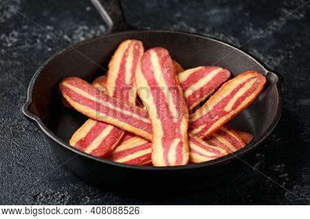 Fried Crunchy Plant Based Vegan Bacon Pieces In A Cast Iron Skillet