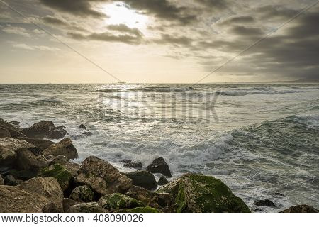 Sunset At Costa Da Caparica, A Famous Place For Water Sports In The Coast Of Portugal