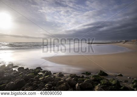 Sunset At Costa Da Caparica, A Famous Place For Water Sports In The Coast Of Portugal