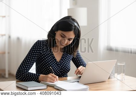 Asian Female Interpreter In Headset Translate Information From Web Conference