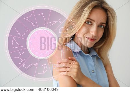 Beautiful Young Woman And Illustration Of Zodiac Wheel With Astrological Signs On Light Background