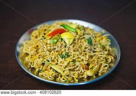 Nepali Waiwai Chowchow Noodles Cooked With Eggs And Vegetables Served On A Plate On The Table. Chau 