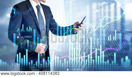 Businessman In Formal Suit Checking Stock Market Rates In Smartphone. Hologram Charts. Business And 