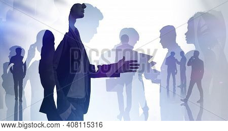 Businessman Silhouette In Formal Suit Holds Out His Hand For A Handshake. Corporate Culture Concept.