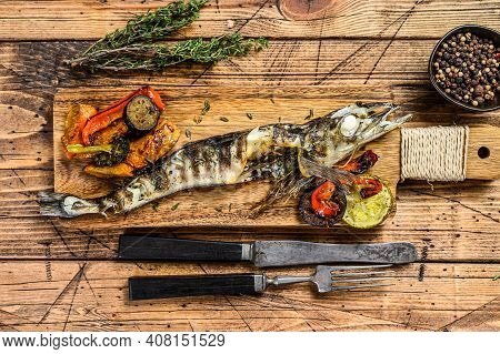 Grilled Whole Icefish With Vegetables. Wooden Background. Top View