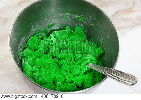 Making Batter For Green Saint Patrick`s Day Cookies By Mixing Ingredients Of Flour Butter Egg And Gr