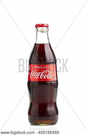 Estonia, Tallinn - 14.02.2021: Coca-cola Classic In A Glass Bottle Isolated On White. Single Glass B