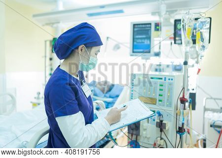 The Specialist Are Checking Continuous Renal Replacement Therapy Equipment And Injection Pump And He