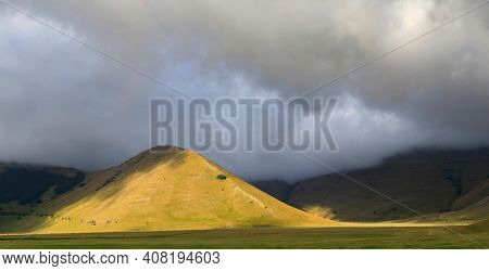 Dramatic mountain landscape near Castelluccio village in National Park Monte Sibillini, Umbria region, Italy
