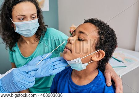 African American Little Boy With His Mother During Pcr Test Of Coronavirus In A Medical Lab. Laborat