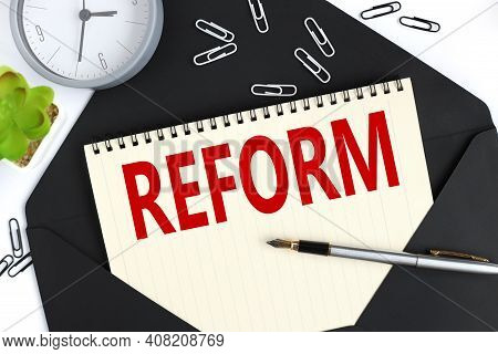 Reform Blackboard - Education Reform Or Other. Hand Writing Reform With Chalk On Black Chalkboard.