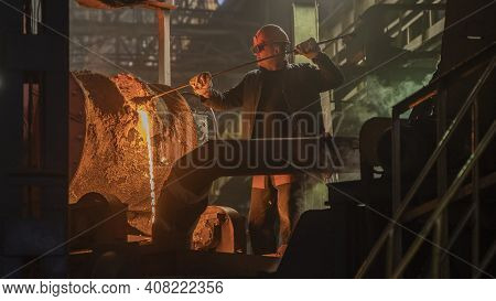 A Steelworker Pours Hot Metal From A Blast Furnace; Lviv, Ukraine, February 10, 2021.