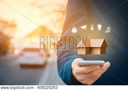 Smart Home, Intelligent House, And Home Automation App Security Concept. Smart Phone User Walking On