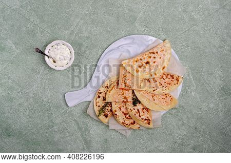 Baked Bread With Vegetable Filling On A Stone Background. Selective Focus.