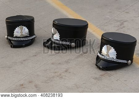 Three Drum Majors Shakos Waiting For Performance Time