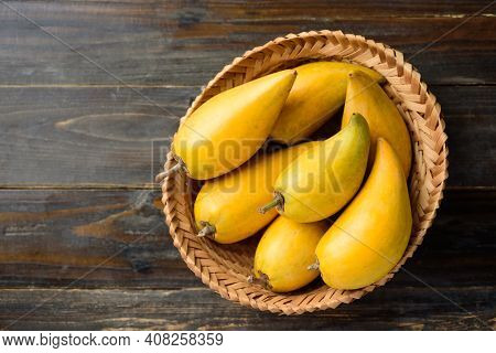 Eggfruit Or Canistel In A Basket On Wooden Table, Thai Fruit, In Thai Names Such As Xiantao, Lamut K