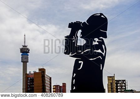 Statue Looking Through Binoculars At The Hillbrow Tower In Johannesburg, South Africa. Soldier Statu