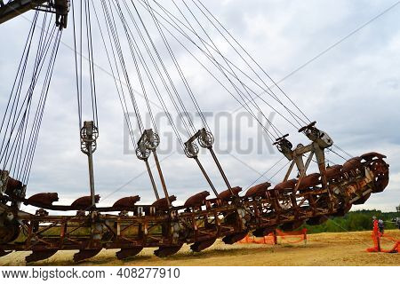 Giant Old Absetzer Rusts In A Sand Quarry. Huge Mining Excavator.