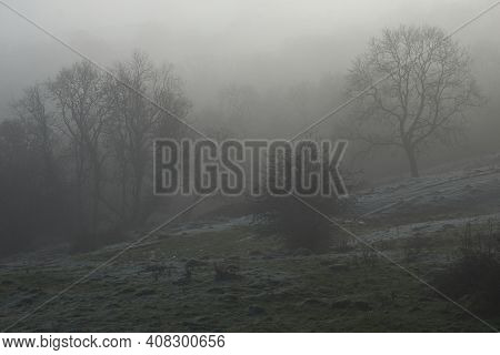Winter Mist And Frost In The Woolley Valley, An Area Of Outstanding Natural Beauty In The Cotswolds 