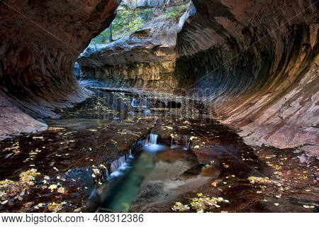 Small cascades and pools at the entrance to the Subway, a unique tunnel scuplted by the Left Fork of North Creek in Zion National Park, Utah