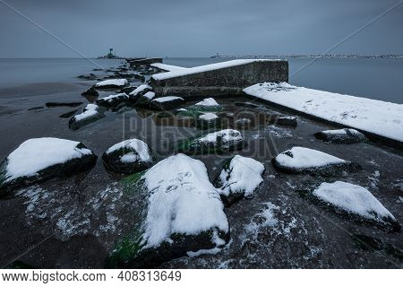 Concrete Breakwater Covered With Snow. Winter Season. Gdanska Bay, Poland.