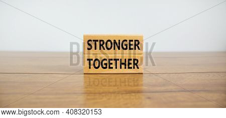 Stronger Together Symbol. Concept Words 'stronger Together' On Wooden Blocks On A Beautiful Wooden T