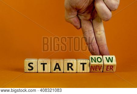 Start Now Or Never Symbol. Businessman Turns Wooden Cubes And Changes Words 'start Never' To 'start 
