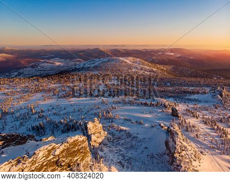 Colorful Winter Sunset In Sheregesh Ski Resort Mountains Covered Trees. Aerial Top View Beautiful Fo