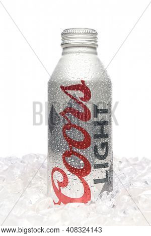 IRVINE, CALIFORNIA - APRIL 15, 22019: Coors Light Aluminum Pint Bottle standing in a bed of ice.
