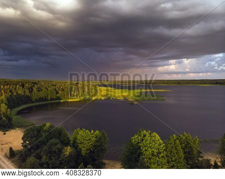 Stromy Clouds Over Eautful Peninsula Between Lakes Snudy And Strusto, National Park Braslau Lakes, B