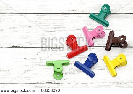 Colorful Paper Clips On White Grunge Wooden Table 
,colorful,design,document,education,equipment,fas