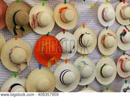 Colorful Handmade Panama Hats Or Paja Toquilla Hats Or Sombrero At The Traditional Outdoor Market In