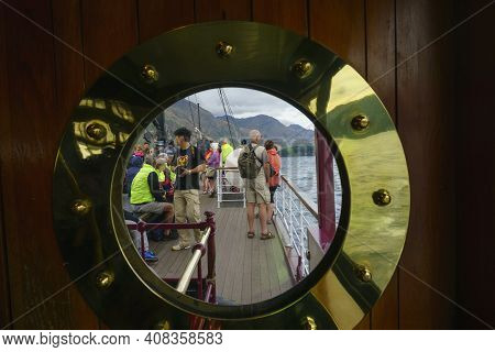 Queenstown New Zealand - March 2 2015; Group Of Mainly Seniors On Deck Sailing On Ship Across Lake W