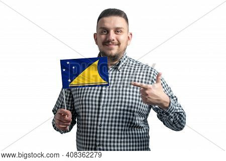 White Guy Holding A Flag Of Tokelau And Points The Finger Of The Other Hand At The Flag Isolated On 