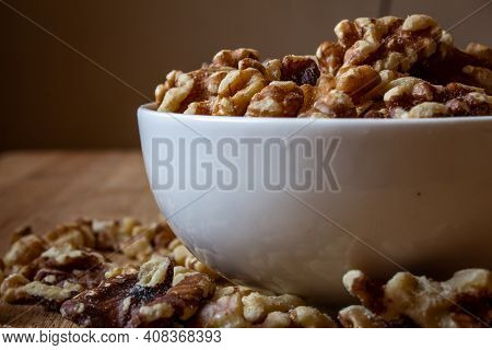 View Of Deshelled Walnuts In A Bowl. Use For Healthy Food Concept