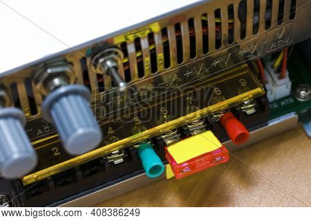 Closeup Of Laboratory Power Supply Terminals With Contacts And Switches On Back Side.