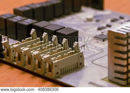 Electronics Concepts. Closeup Macro Shot Of Dusty Utilized Printed Circuit Board With Integrated Cir