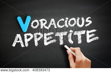 Hand Writing Voracious Appetite On Blackboard, Concept Background