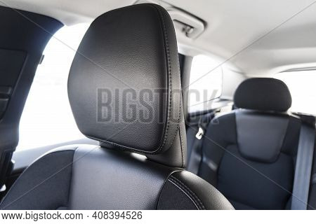 Modern Luxury Car Black Leather Interior. Part Of Perforated Leather Car Seat Details With White Sti