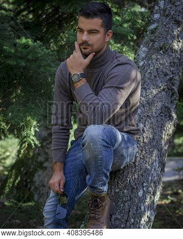 Athens - Feb 12 2021 : A Young Man Posing In Front Of A Tree