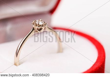 Engagement Ring From The White Gold With Diamond In Red Velvet Gift Box Isolated On White Background