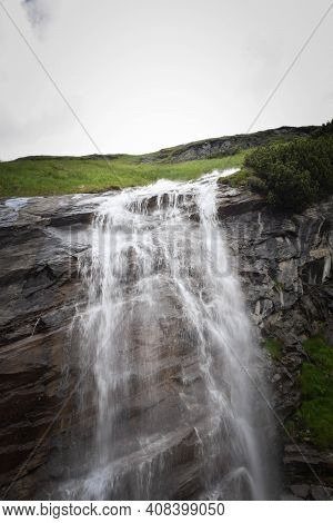 Small Watefall In Austria Nature. Nature Near The Glossglockner, Summer Nature.