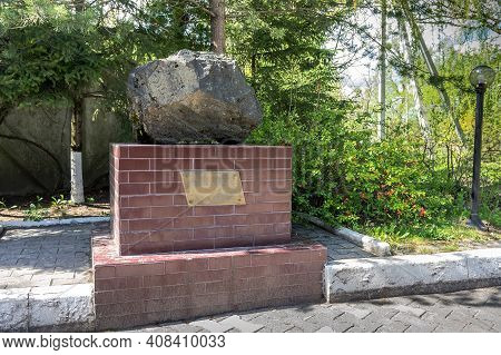 Russia, Kaliningrad, Shady Alley Street. Monument To A Meteorite. The Mammon Meteorite. A Block Of I
