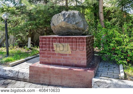 Russia, Kaliningrad, Shady Alley Street. Monument To A Meteorite. The Mammon Meteorite. A Block Of I