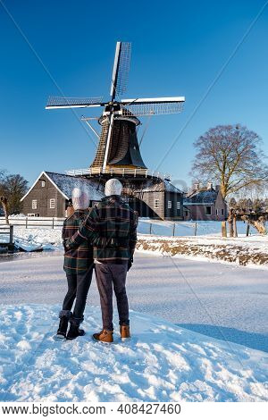 Pelmolen Ter Horst, Rijssen Covered In A Snowy Landscape Overijssel Netherlands, Historical Wind Mil