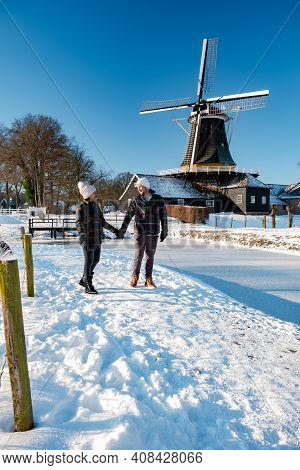 Pelmolen Ter Horst, Rijssen Covered In A Snowy Landscape Overijssel Netherlands, Historical Wind Mil