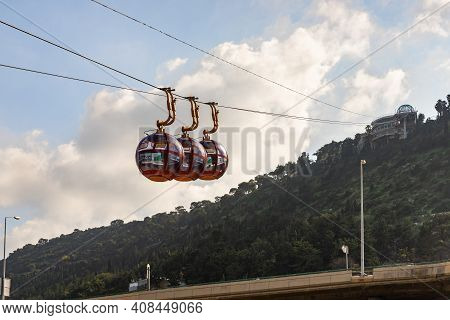 Haifa, Israel, February 13, 2021 : Cable Car Cabins Move From The Lower Station On The Waterfront To