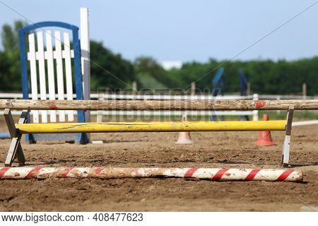 Colorful Barriers On The Ground For Jumping Horses And Riders At Riding School As A Background.obsta